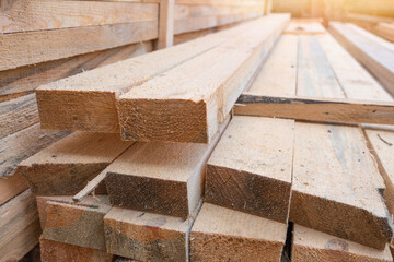 Storage of wooden planks at the sawmill. Sawing and drying of wood. Industrial background