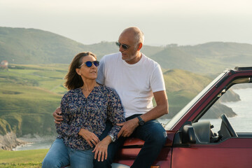 Aged couple enjoying their retirement holidays on the coast