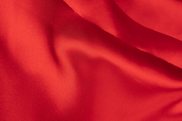Wrinkled red silk or satin textile for elegance background, with copy space, Top view for design
