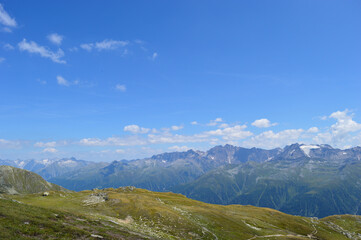 Swiss landscape with blue sky and mountains