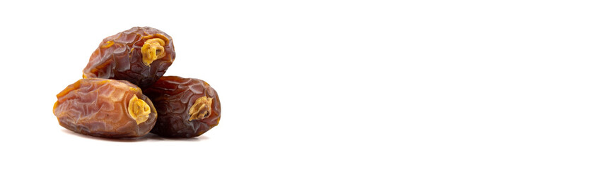 Date fruits on the white background. Fresh Medjool Dates for ramadan. Empty space for text. Copy space