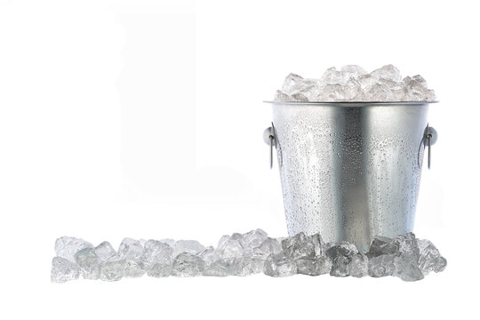 Full metal bucket with ice cubes and pieces of crushed ice isolated on white background.