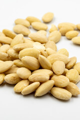 Peeled almond kernel isolated on white background. Snack fresh nuts. close up story format