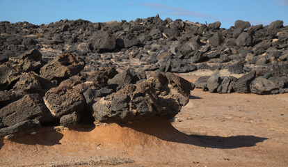 Fototapeta na wymiar Porous lava volcanic rock around around Playa de la Concha beach in El Cotillo La Oliva municipality of Fuerteventura, Canary Islands 