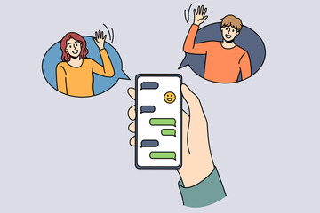 Online chat and technologies concept. Human hand holding smartphone with chat and smiling friends greeting from sides vector illustration 