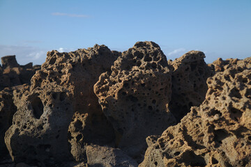 Porous lava volcanic rock around around Playa de la Concha beach in El Cotillo La Oliva municipality of Fuerteventura, Canary Islands
