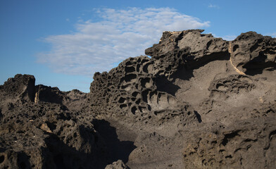 Porous lava volcanic rock around around Playa de la Concha beach in El Cotillo La Oliva...