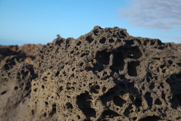 Porous lava volcanic rock around around Playa de la Concha beach in El Cotillo La Oliva municipality of Fuerteventura, Canary Islands
