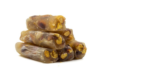 Pistachio Turkish Delight isolated on a white background. Delight for snack. Empty space for text. Copy space. local name antep sucuk