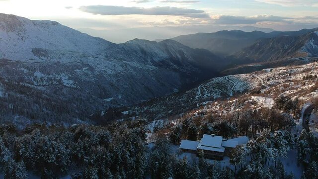Aerial view of the snowy mountain Taygetus (also known as Taugetus or Taygetos) above Messenia unit in Peloponnese, Greece. Amazing natural scenery of the highest mountain in Peloponnese during winter