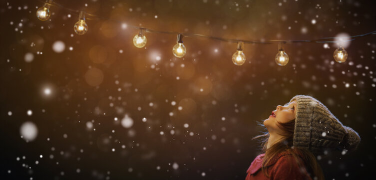 A little girl rests on top at christmas - childhood belief