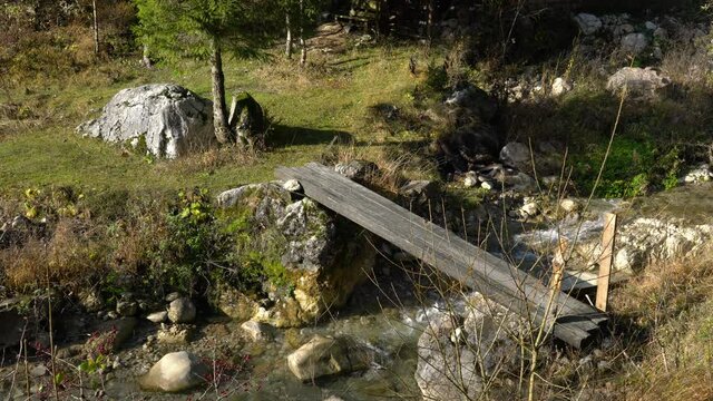  Wooden bridge on a mountain river, simply - (4K)