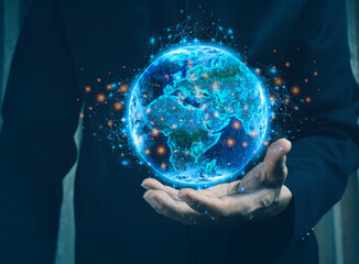 Businessman holding the world in the palm of his hands concept for global business.