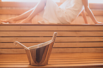 Fototapeta na wymiar Young woman having rest in sauna alone