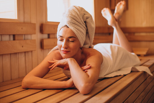 Young woman having rest in sauna alone