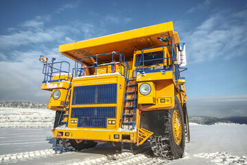 Big yellow dump truck in coal mine 