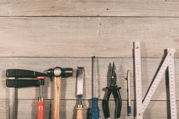 Carpentry tools arranged in a row with copy space
