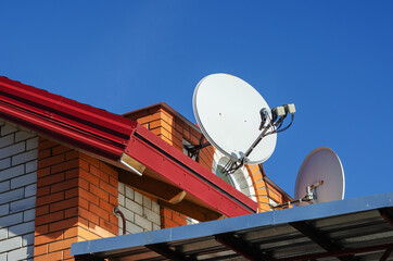 The roof of a beautiful cottage or country house against the blu