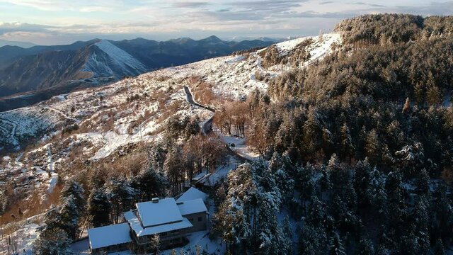 Aerial view of the snowy mountain Taygetus (also known as Taugetus or Taygetos) above Messenia unit in Peloponnese, Greece. Amazing natural scenery of the highest mountain in Peloponnese during winter