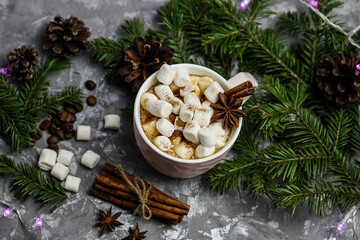Hot chocolate with marshmallows, a warm cozy Christmas drink on a gray background. Christmas hot chocolate with marshmallows. festive decor.