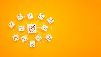 Top view of wooden blocks with icons laid scattered over a yellow background, Space for text. Flat...