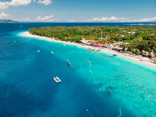 Naklejka na ściany i meble Tropical island with holiday beach, turquoise ocean and boats
