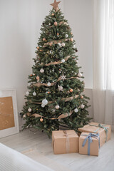 Fototapeta na wymiar christmas tree and gift boxes in living room