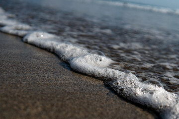 white foam on the shore, bali beach
