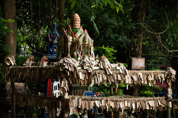 Phra Phum Shrine for thai people travel travel visit respect praying deity angel and write on bamboo plate for blessing of Baan Huay Nam Sai at Suan Phueng on November 1, 2021 in Ratchaburi, Thailand