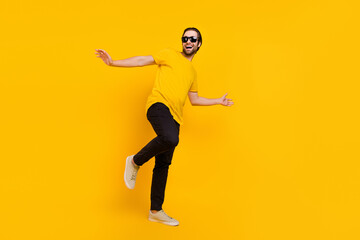 Fototapeta na wymiar Full body profile side photo of young man have fun eyewear clubber isolated over yellow color background
