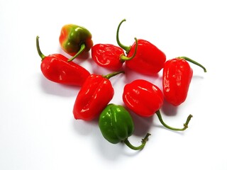 red chilies spread on a white background
