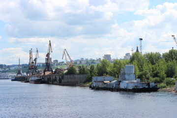 Fototapeta premium Nizhny Novgorod city - view from the Volga river to the river port, cranes