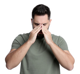Young man suffering from headache on white background
