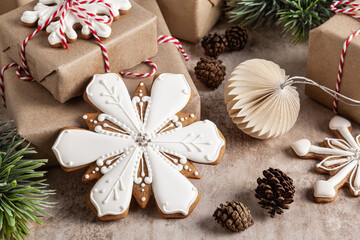Christmas gift boxes decorated with homemade gingerbread snowflakes.