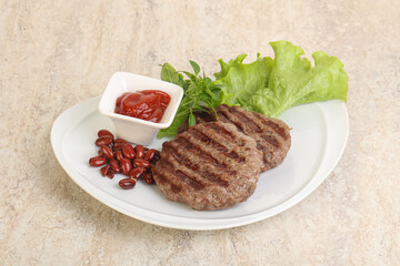 Grilled beef burger cutlet with sauce