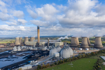 Obraz premium Aerial view of a coal fired Power Station with Biofuel fuel storage tanks
