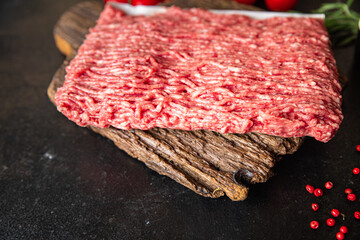 minced meat raw pork, beef or veal, lamb meal snack on the table copy space food background 