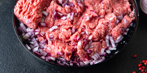 minced meat raw pork, beef or veal, lamb meal snack on the table copy space food background 