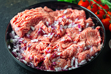 minced meat raw pork, beef or veal, lamb meal snack on the table copy space food background 