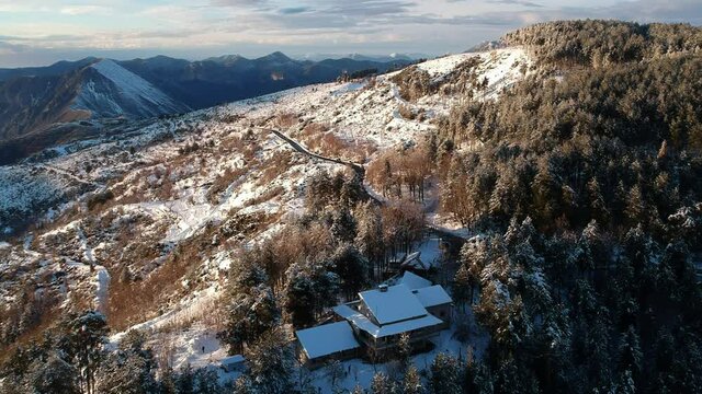 Aerial view of the snowy mountain Taygetus (also known as Taugetus or Taygetos) above Messenia unit in Peloponnese, Greece. Amazing natural scenery of the highest mountain in Peloponnese during winter