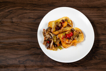 Eggplant appetizer antipasti made with yellow pepper, onion, raisin, and olive oil. Top View