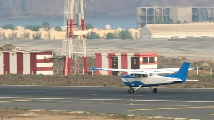The takeoff of the most popular airplane in the history of aviation. Light single-engine airplane gaining altitude - Powered by Adobe