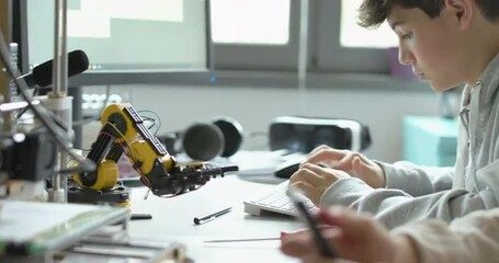 Engineering students printing prototypes in the lab - Powered by Adobe