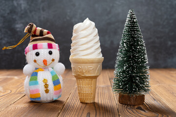 ice cream cone with Christmas tree and snowman nearby