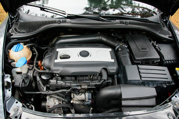 engine, open hood of a sports car. breakdown, repair. battery car engine detail motor. close-up of...