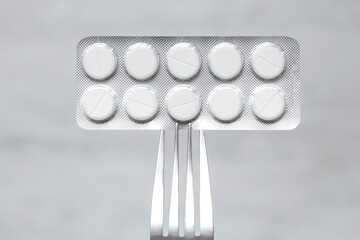 pills in blister on a fork