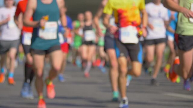 Defocused marathon runners in slow motion 180fps
