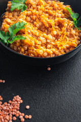red lentils food vegetable stewed legumes and curry spices ready to eat meal snack on the table copy space food background