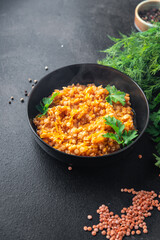 red lentils food vegetable stewed legumes and curry spices ready to eat meal snack on the table copy space food background