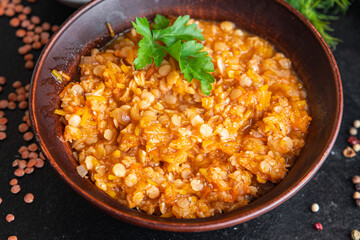 red lentils food vegetable stewed legumes and curry spices ready to eat meal snack on the table copy space food background